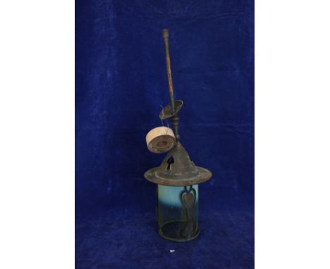 An Art Nouveau copper pendant light with pierced decoration and vaseline glass shade.  Est £30-50