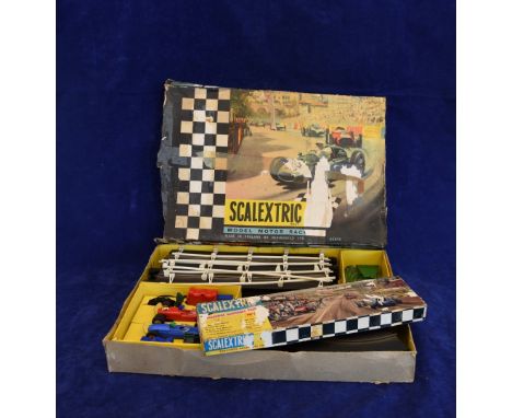 A Scalextric model motor racing set made in England by Minimodels Limited, together with a Scalextric trackside accessory pac