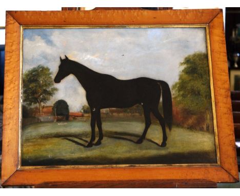 An oil on canvas portrait of a black horse in a country landscape with trees and buildings to the rear ground.  Unsigned.  23