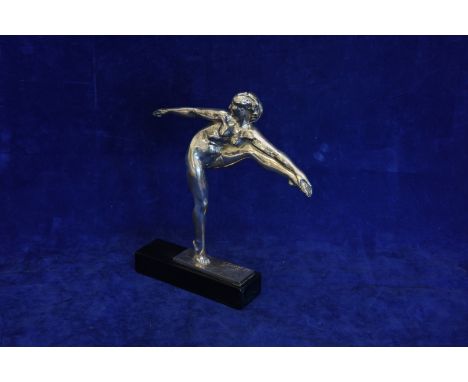 A Gennarelli, an Art Deco silvered bronze depicting a female nude dancer holding her toe with her left hand.  Signed to base 