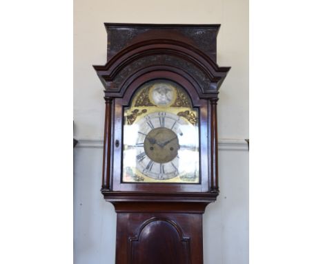 An 18th century mahogany cased longcase clock, the hood with blind fret carved frieze and arched top above an arched glazed d