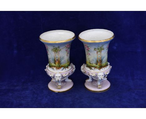 A pair of Paris porcelain vases, circa 1860-90. Each of inverted bell form painted in colours with a continuous arbour suspen