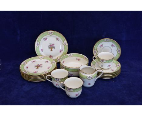 A Theodore Haviland Limoges tea set with gilt scale borders and floral spray decoration comprising nine teacups, eight saucer