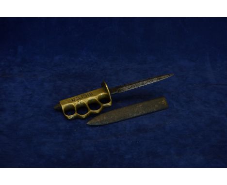 A First World War American knuckle duster/dagger with 6ins blade.  The handle engraved US 1918, the reverse with indistinct n