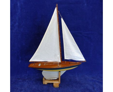 A model pond yacht “Ailsa Yacht made in Largs Scotland” with blue, yellow and silver hull, varnished pine deck and name badge