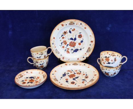 An early 19th century Wedgwood earthenware part tea and coffee set decorated in the Imari style with floral sprays and with b