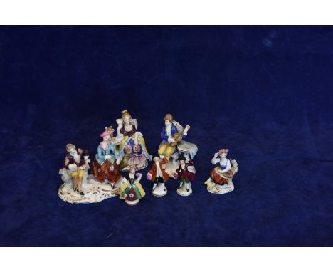 A set of four Samson porcelain figures depicting musicians and dancers including a seated female lute player, two dancing gen