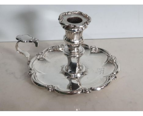 A George IV silver Chamber Candlestick engraved crest, shaped rim, Sheffield 1824, maker: J &amp; T Settle