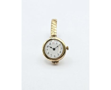 A 1930s Lady's Wristwatch having white enamel dial with Arabic numbers in circular 9ct gold case on rolled gold expanding bra