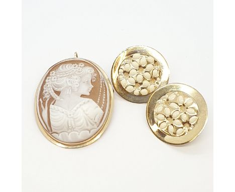 A carved Shell Cameo Brooch/Pendant in yellow metal stamped 14ct and a pair of Enamel and Yellow Metal Earrings stamped 375, 