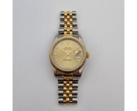 A gentleman's Rolex Oyster Perpetual Datejust Wristwatch the brushed effect champagne dial with diamond dot hourly markers, s