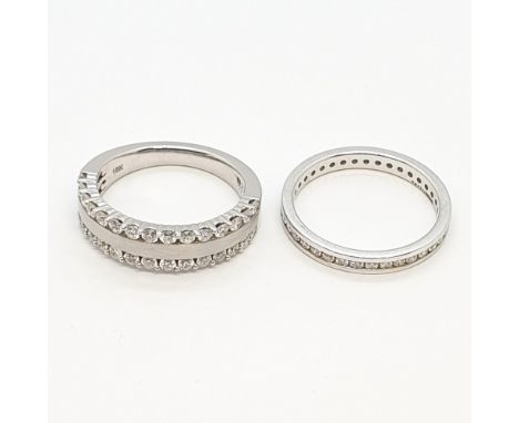 A Diamond Eternity Ring (ring size N 1/2) and a half-hoop Diamond Ring (ring size N) in 18ct white gold, total weight approx 