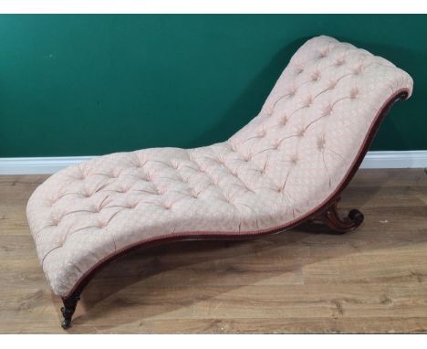 A Victorian button upholstered Day Bed on scroll supports and casters