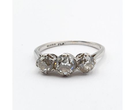 A three stone Diamond Ring claw-set old-cut diamonds in white metal galleried mount on white metal shank stamped PLA, ring si