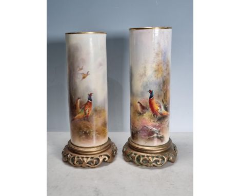 Two Royal Worcester cylindrical Spill Vases painted scene of pheasants, on pierced circular plinths, 10 1/2in and 10in H, No.