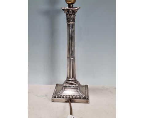 An Edward VII silver Candlestick, converted to lamp, with fluted column and corinthian capital on square base, Sheffield 1903