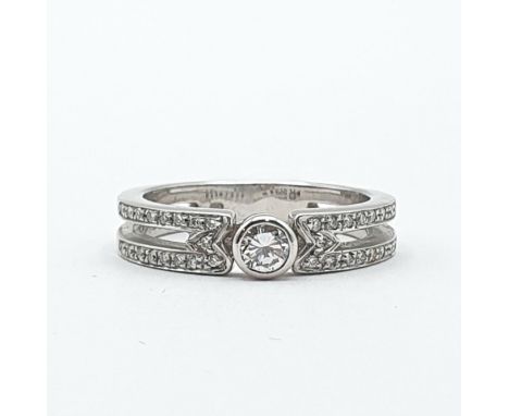 A Diamond Ring by Mappin &amp; Webb, rubover-set brilliant-cut diamond on a split shank pavé-set single-cut diamonds in plati