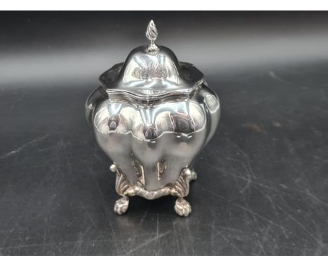 A Victorian silver Tea Caddy of bombe form with hinged lid having spiral finial, raised on paw feet, Chester 1896 175 gms.  5