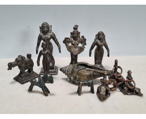 A collection 19th century Indian bronze Dieties, conch shell and various bronze seals.