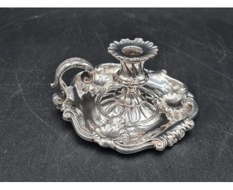 A Victorian silver Chamber Candlestick with scroll border and handle, London 1854