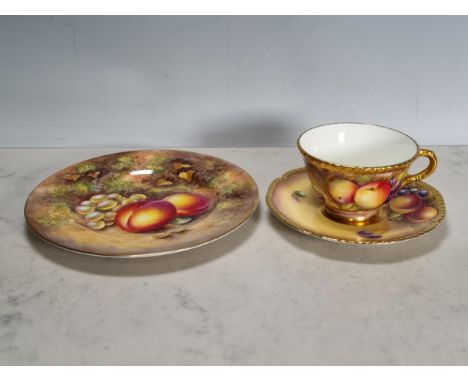 A Royal Worcester fruit painted Plate, peaches and grapes on an autumnal ground, signed 'Freeman', 8in Diam, and a Cup and Sa