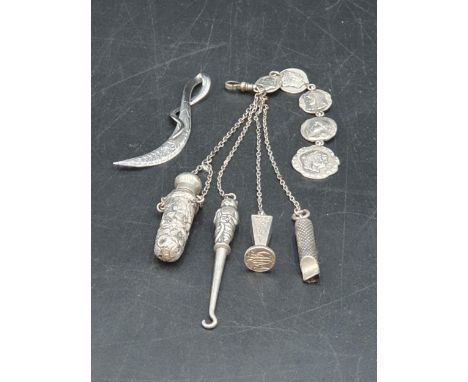 A sterling silver Scarf Clip with leafage engraving, and a white metal Chatelaine with whistle, seal, button hook and scent b