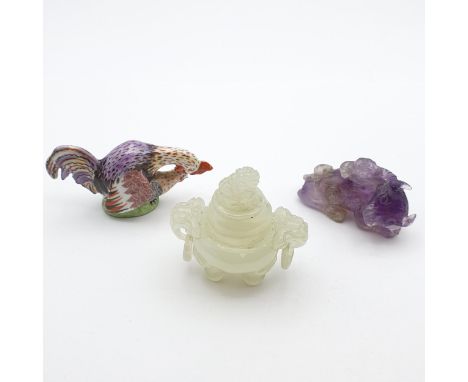 A small carved jade type Jar and Cover with dog of fo finial, a pair of ring handles and raised on tripod supports, 2 1/2 in 