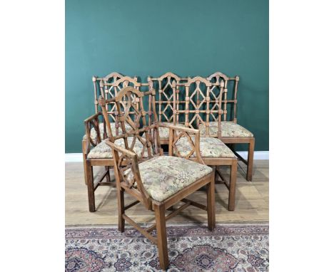 A set of six Chinese Chippendale style Dining Chairs with turned and shaped backs, drop-in seats on squared supports and stre