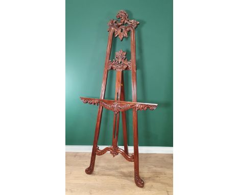 A good quality reproduction Easel with leafage scroll carving, 6ft 2in
