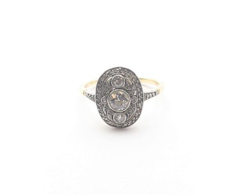 An Art Deco Diamond Panel Ring, central millegrain-set old cut diamond with two smaller millegrain-set old cut diamonds above