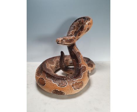 An Italian large ceramic coiled Snake with brown painted details,15in There are no majorly obvious faults or repairs that we 