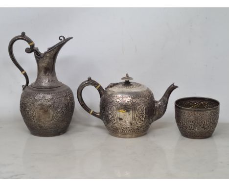 A Victorian silver three piece Tea Service decorated Indian style figures, leafage scrolls, etc, vacant cartouches, Glasgow 1