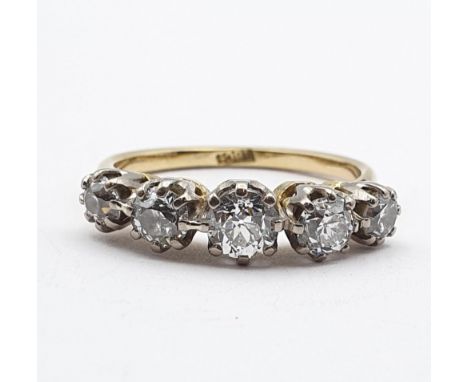 An early 20th century five stone Diamond Ring, claw-set old-cut diamonds in white metal on split shouldered yellow metal shan
