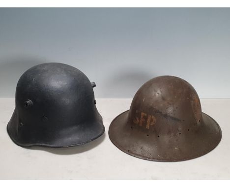 A German WW1 Helmet and a WWII Zuckerman Helmet