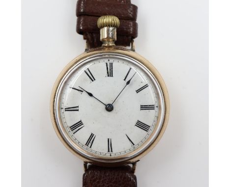 WALTHAM: WWI period gold plated officer's trench watch, converted from a crown winding fob watch with soldered lugs and brown