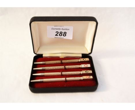 A cased set of four silver and enamel bridge pencils
