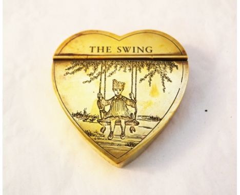 A brass heart shaped snuff box engraved with child on a swing and titled 'The Swing'