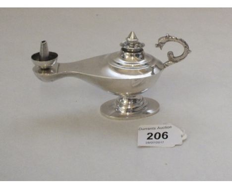 A silver Aladdins lamp lighter