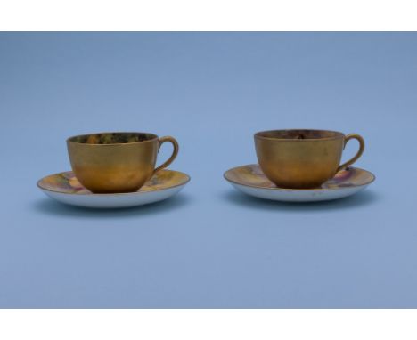 A GROUP OF ROYAL WORCESTER FRUIT DECORATED ITEMS
Comprising:
A pair of tea cups and saucers, various signatures including H.A