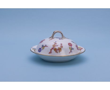 A BISHOP AND STONIER DISH AND COVER
Late 19th century decorated with a floral and butterfly pattern with gilt border

Please 