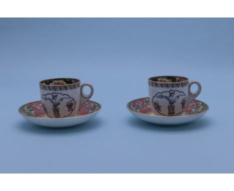 A PAIR OF ASHWORTH IRONSTONE COFFEE CUPS AND SAUCERS
2nd half 19th Century, printed Royal coat of arms marks 
With Chinoiseri