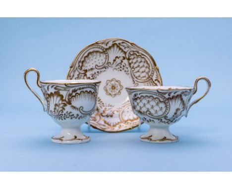 THREE GILT DECORATED TRIOS
A G. Grainger Worcester example, with gilt rocaille decoration, circa 1850, printed marks; togethe