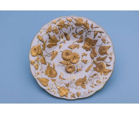 A MEISSEN GILT DECORATED BOWL
20th Century
Moulded and gilt decorated with convolvulus vines, blue crossed swords and impress