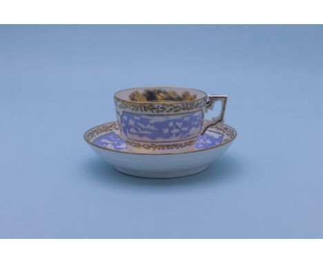 A MILES MASON TEA CUP AND SAUCER
Early 19th Century 
With moulded and landscape painted decoration, gilt coral borders 

Plea