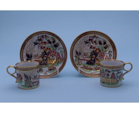A PAIR OF BARR WORCESTER COFFEE CANS AND SAUCERS
Circa 1800
Decorated in the imari palette with a stylised oriental landscape