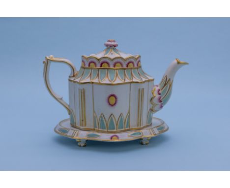 A POLYCHROME TEAPOT AND STAND
Early-mid 19th Century
Shaped oval on conforming stand, decorated with flowerheads, stiff leave