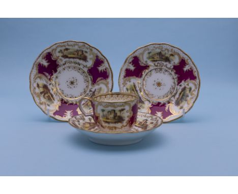 A GROUP OF CLARET GROUND TEA WARES
19th Century
Comprising a group of three saucers and a tea cup, painted with landscape vie