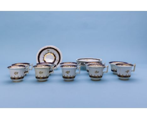 A PART TEA AND COFFEE SERVICE
Early-mid 19th Century 
With blue and gilt foliate borders, comprising: five tea cups; five cof