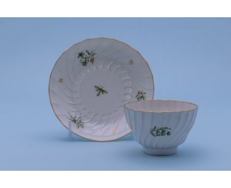 TWO TEA BOWLS AND SAUCERS
Late 18th Century
One spirally fluted and painted with a green dragonfly and foliate sprigs; the ot