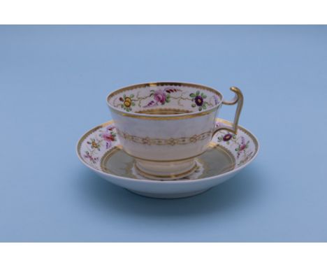 TWO TEA CUPS AND SAUCERS
A Spode example, pattern 2885, circa 1820, painted with flowers; and a green ground example attribut